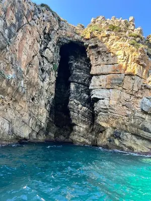 a cave in the side of a rocky cliff at ViLoKa Sicilian Guest House in Calatafimi