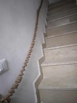 a rope leading down a stairway in a house at Casa Gerani in Castellammare del Golfo
