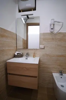 a bathroom with a sink and a mirror at Cori ri Palermo in Palermo