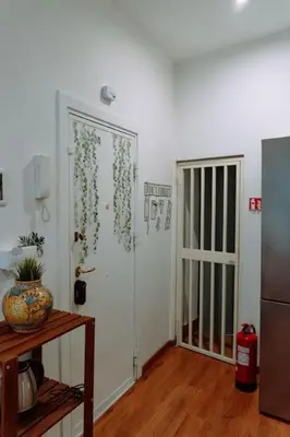 a bathroom with a mirror and a toilet and a sink at Croce Barocca Apartment in Palermo