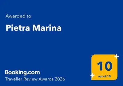 a yellow rectangle with the text awarded to pitteria marina at Pietra Marina in Capaci
