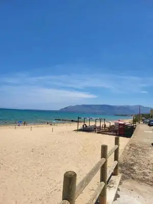 a view of a beach with a wooden fence at Spacious Apartment in Balestrate 70 m² with Balcony in Balestrate