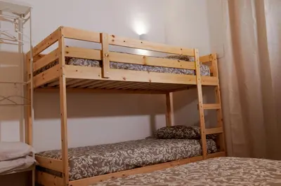 a couple of bunk beds in a room at Palermo Home Politeama in Palermo