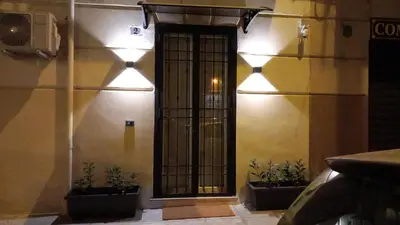 a door in the side of a building with plants at Palermo Home Politeama in Palermo