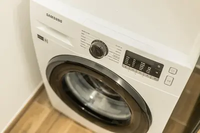 a washing machine is sitting in a room at Politeama Luxury Suite in Palermo