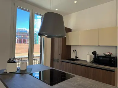 a kitchen with a sink and a window with a view at Politeama Libertà Home Sweet Home in Palermo