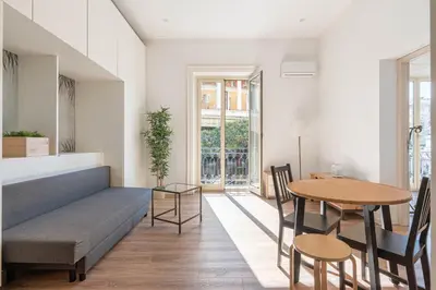 a living room with a couch and a table at Turati Apartment al Politeama by Wonderful Italy in Palermo