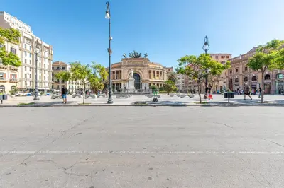 an empty street in front of a building at Turati Apartment al Politeama by Wonderful Italy in Palermo