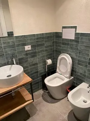 a bathroom with a toilet and a sink at Appartamento Centro Storico in Palermo