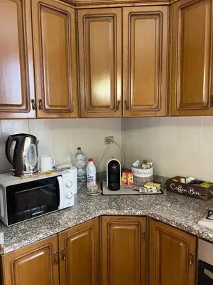 a kitchen counter with a microwave on top of it at Casa MaRo' in Capaci