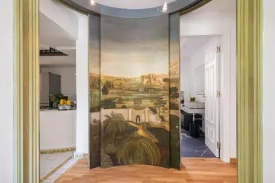 a room with a painting on the wall at Libertà Appartement in Palermo