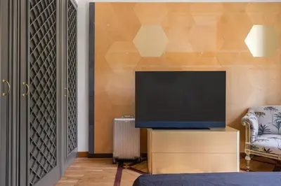 a living room with a television on a dresser at Libertà Appartement in Palermo