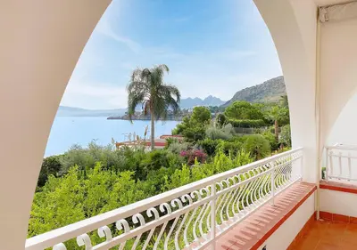 a balcony with a view of the water at Solemar Sicilia - Ville Paradiso in Santa Flavia