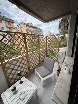 a balcony with a chair and a table at La Casa di Trudy in Palermo