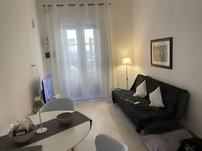 a living room with a couch and a table at la fervoriana in Palermo