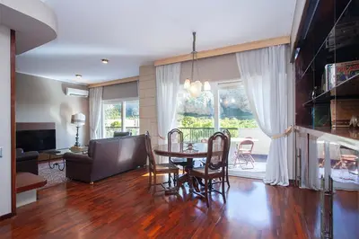 a living room with a table and a couch at Casa Adele in Palermo