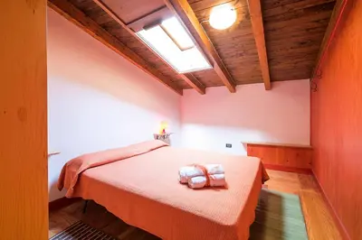 a bedroom with a bed and a skylight at Casa Mary in Castellammare del Golfo