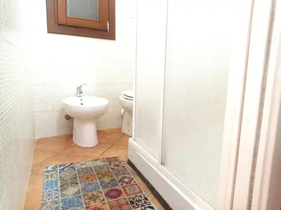 a bathroom with a toilet and a sink at Casa Mary in Castellammare del Golfo