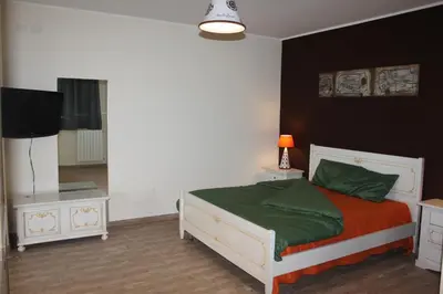 a bedroom with a bed and a television in it at Locanda Del Drago in Monreale