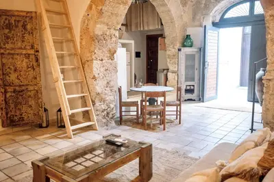 a living room with a couch and a table at Duplex Townhouse with Gigantic Terrace in Palermo