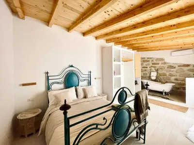 a bedroom with a bed and a bath tub at Duplex Townhouse with Gigantic Terrace in Palermo