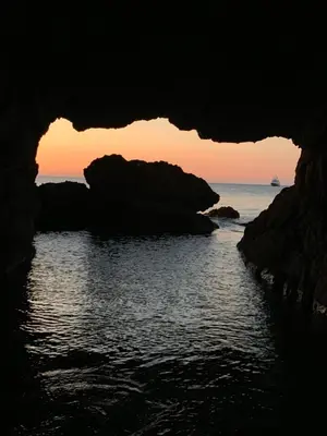 a view of the ocean from inside a cave at sunset at Casa Vacanze La Dolce Vita in Terrasini