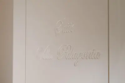 a sign that reads all inclusive in cursive handwriting at Butera 505-Luxury Suites in Bagheria