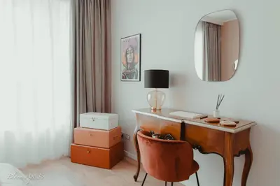 a room with a desk with a chair and a mirror at Bloom Apartment 35 in Palermo