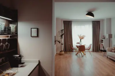 a kitchen and living room with a table and chairs at Bloom Apartment 35 in Palermo