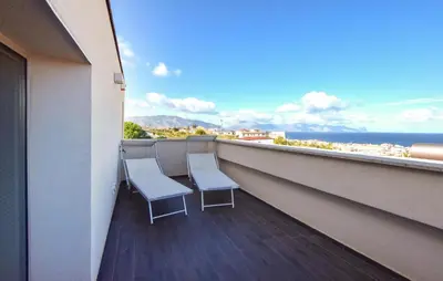 two chairs on a balcony with a view of the ocean at Amazing Home In Balestrate With Wifi in Balestrate