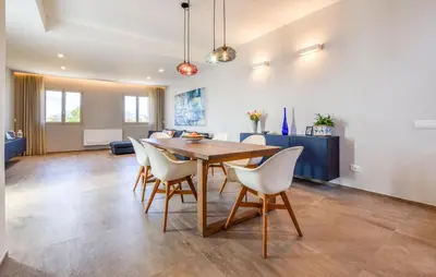 a dining room and living room with a table and chairs at Amazing Home In Balestrate With Wifi in Balestrate