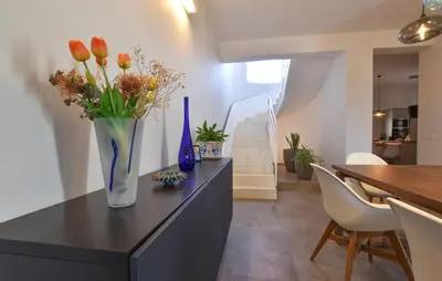 a vase with flowers on a counter in a room at Amazing Home In Balestrate With Wifi in Balestrate