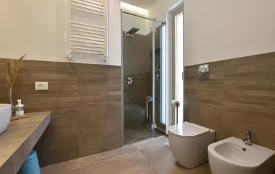 a bathroom with a shower and a toilet and a sink at Amazing Home In Balestrate With Wifi in Balestrate