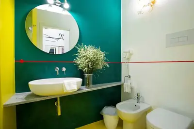 a bathroom with a sink and a mirror at Olivella 11 in Palermo
