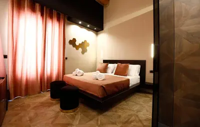 a bedroom with a bed with two towels on it at Spera Luxury Palermo & SPA in Palermo