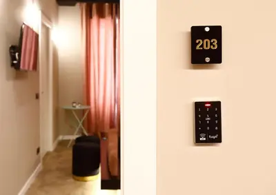a door with a remote control on the wall at Spera Luxury Palermo & SPA in Palermo