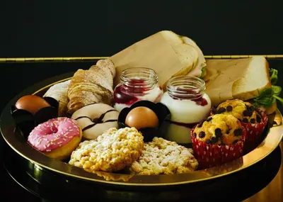 a tray of different types of donuts and pastries at Spera Luxury Palermo & SPA in Palermo