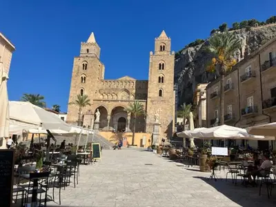 a street with tables and chairs in front of a building at Civico 22 Casa Vacanza in Torretta