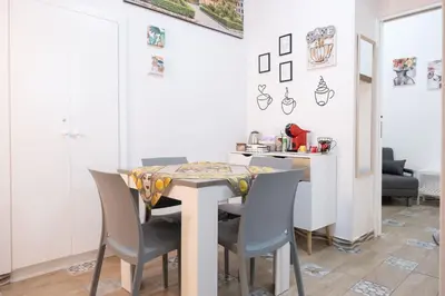 a dining room with a table and chairs at Tra i vicoli di Ballarò in Palermo