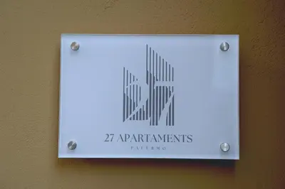 a sign on a wall that reads apartmentments parenthood at 27 Apartaments Palermo in Palermo