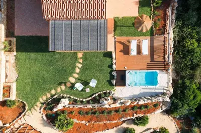 an overhead view of a house with a yard at Villa Faraglioni Cala Bianca in Castellammare del Golfo
