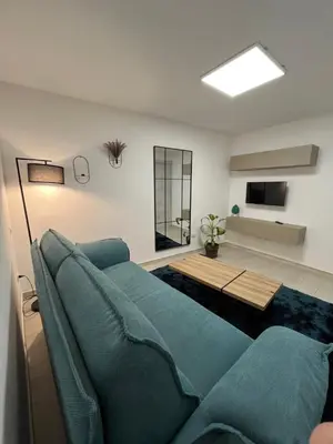 a living room with a couch and a table at La Terrazza di Nela in Bagheria