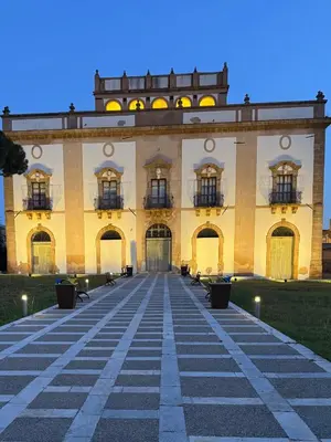 a large building with windows and a walkway at La Terrazza di Nela in Bagheria