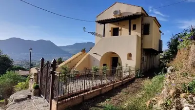 a building with a fence in front of it at Casale di Sicilia in Monreale