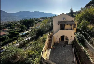 a small white church on a hill with a view at Casale di Sicilia in Monreale