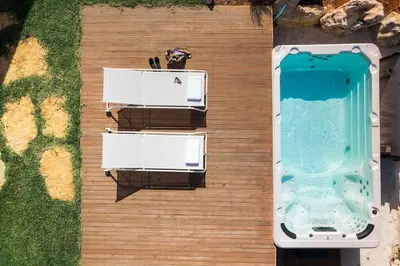 an overhead view of a swimming pool next to at Villa Guidaloca Cala Bianca in Castellammare del Golfo