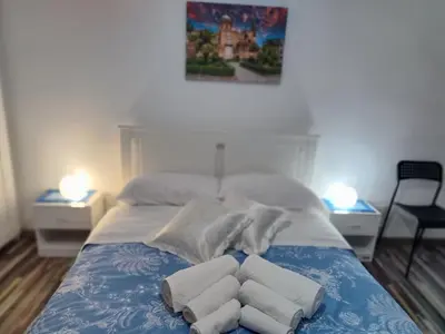 a bedroom with a bed with towels on it at La Casetta al Cassaro in Palermo