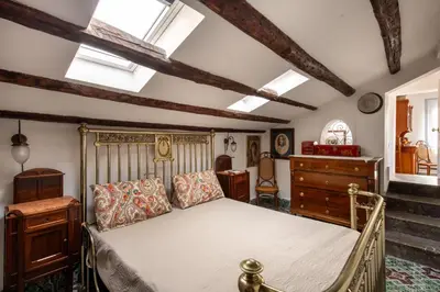 a bedroom with a bed and some skylights at Alloro House with Terrace by Wonderful Italy in Palermo