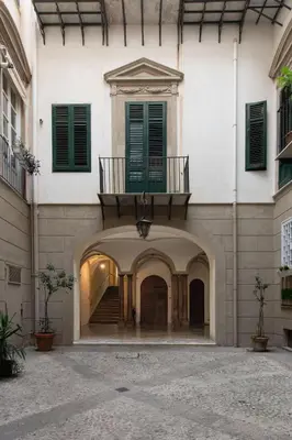 an entrance to a building with a balcony at Alloro House with Terrace by Wonderful Italy in Palermo