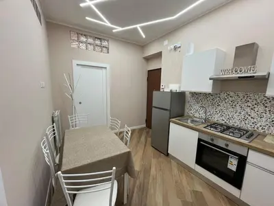 a kitchen with a table and a stove top oven at Casa Miriam 281 in Palermo